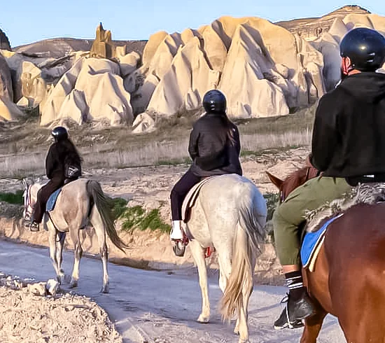 Horseback riding through Cappadocia valleys