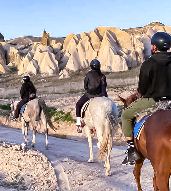 Horseback riding through Cappadocia valleys